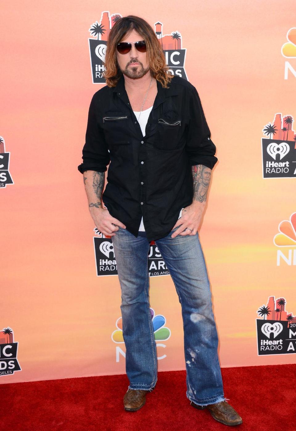 Billy Ray Cyrus arrives at the iHeartRadio Music Awards at the Shrine Auditorium on Thursday, May 1, 2014, in Los Angeles. (Photo by Jordan Strauss/Invision/AP)