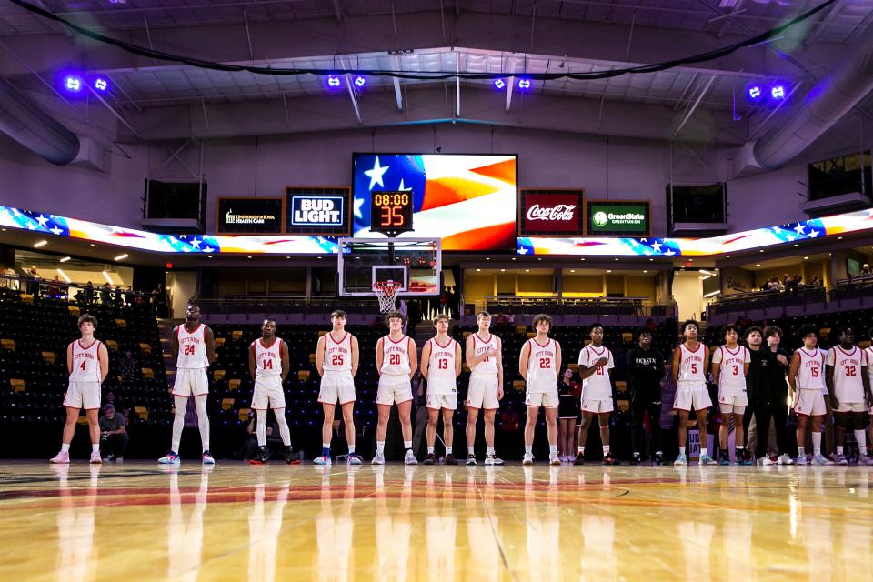 Iowa City High players stand as the national anthem is performed during a Class 4A high school boys basketball game against Iowa City West, Sunday, Jan. 8, 2023, at Xtream Arena in Coralville, Iowa.