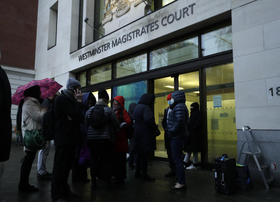 Julian Assange supporters mixed with members of the media queue up outside Westminster Magistrates Court to get a seat at his Bail hearing in London, Wednesday, Jan. 6, 2021. On Monday, Judge Vanessa Baraitser ruled that Julian Assange cannot be extradited to the US. because of concerns about his mental health. Assange had been charged under the US's 1917 Espionage Act for "unlawfully obtaining and disclosing classified documents related to the national defence". Assange remains in custody, the US. has 14 day to appeal against the ruling. (AP Photo/Matt Dunham)