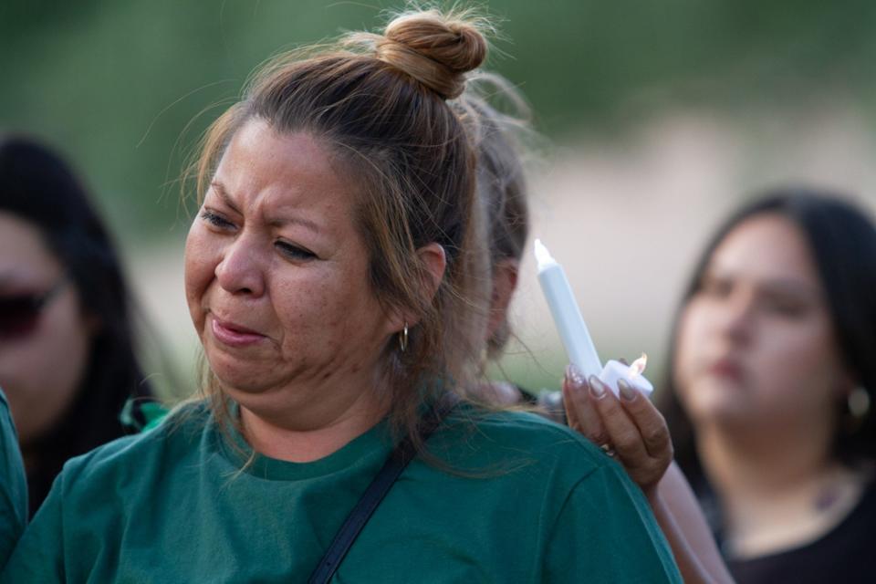 Ana Piedra cries during the vigil for her husband Daniel Piedras Garcias who was fatally shot on US 54 while driving for Uber on June 16, 2023