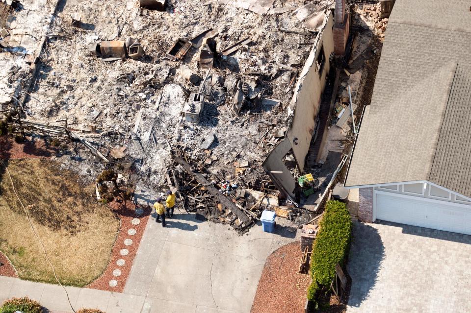 <p>An aerial view shows firefighters working at a burned property in Santa Rosa, Calif., on Oct. 12, 2017. (Photo: Josh Edelson/AFP/Getty Images) </p>