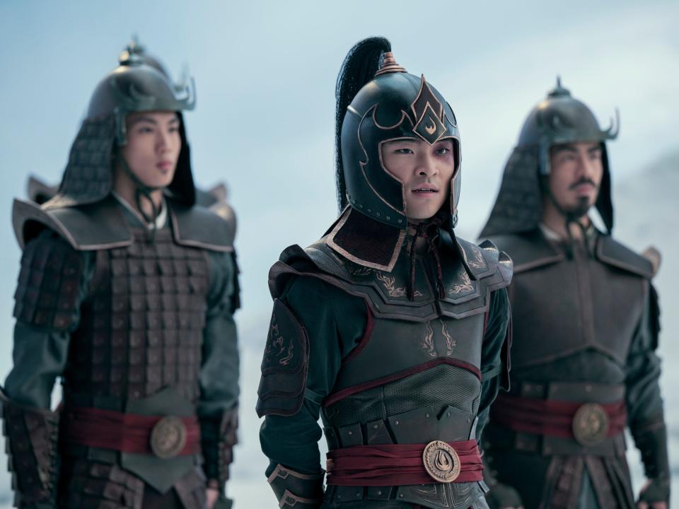 zuko accompanied by two fire nation soldiers in avatar, each wearing helmets