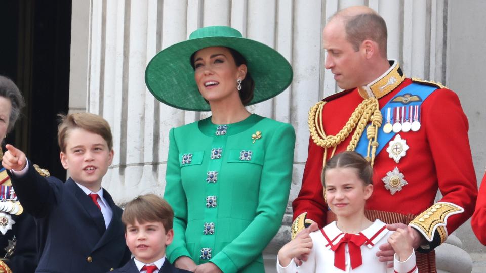 Prince George of Wales, Prince Louis of Wales, Princess Charlotte of Wales, Catherine, Princess of Wales and Prince William, Prince of Wales stand on the balcony of Buckingham Palace to watch a fly-past of aircraft by the Royal Air Force during Trooping the Colour on June 17, 2023 in London, England.