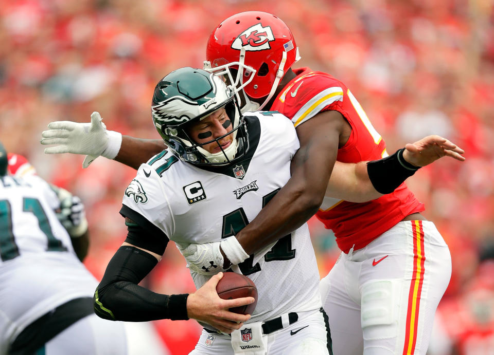 <p>Quarterback Carson Wentz #11 of the Philadelphia Eagles is sacked by outside linebacker Dee Ford #55 of the Kansas City Chiefs during the 1st half of the game at Arrowhead Stadium on September 17, 2017 in Kansas City, Missouri. (Photo by Jamie Squire/Getty Images) </p>