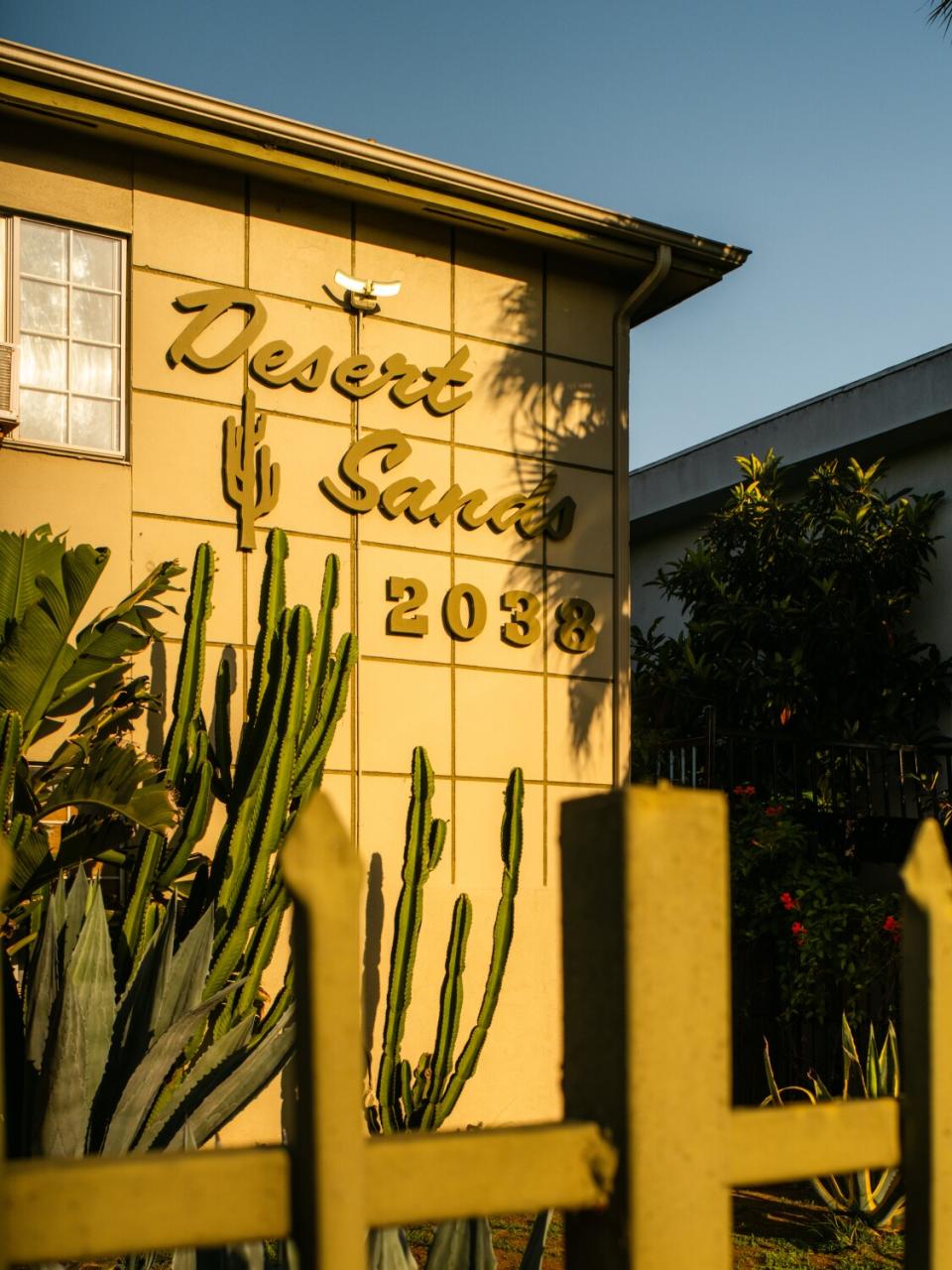 Apartment building sign that reads "Desert Sands 2038."