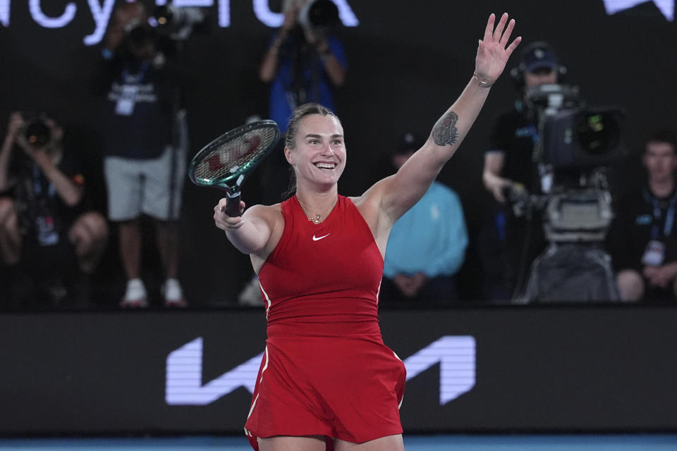 Aryna Sabalenka of Belarus celebrates after defeating Zheng Qinwen of China in the women's singles final at the Australian Open tennis championships at Melbourne Park, Melbourne, Australia, Saturday, Jan. 27, 2024. (AP Photo/Andy Wong)