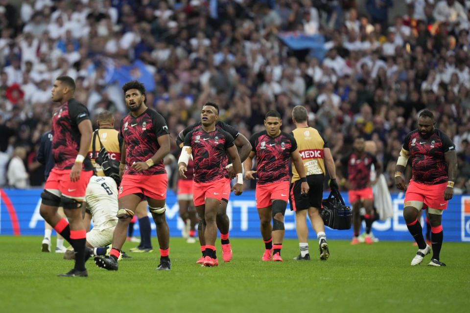 Fiji's players react after a try by Fiji's Vilimoni Botitu during the Rugby World Cup quarterfinal match between England and Fiji at the Stade de Marseille in Marseille, France, Sunday, Oct. 15, 2023. (AP Photo/Pavel Golovkin)