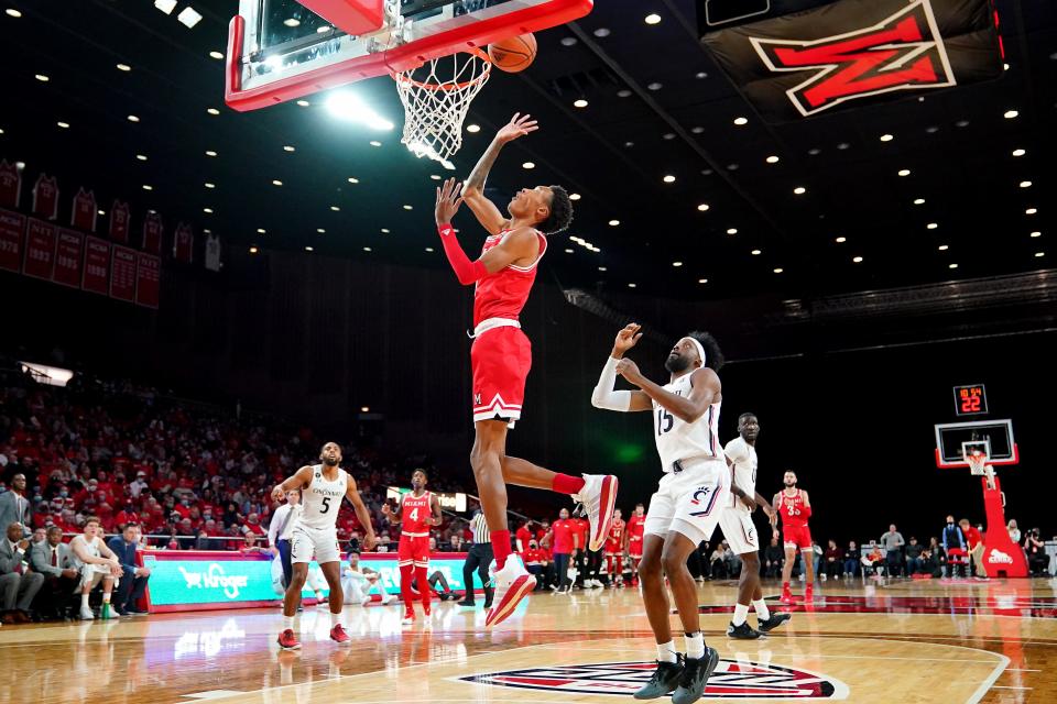 Miami RedHawks forward Kamari Williams lays in a basket in the first half against the Cincinnati Bearcats, Dec. 1, 2021, at Millett Hall in Oxford.