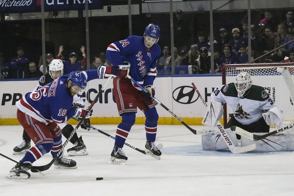 New York Rangers' center Vincent Trocheck, front left, shoots toward the goal during an NHL hockey game against the Arizona Coyotes, Monday, Oct. 16, 2023, in New York. (AP Photo/Bebeto Matthews)