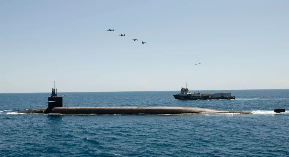 An A-10 Thunderbolt II aircraft above the ballistic missile submarine USS Wyoming on July 15.