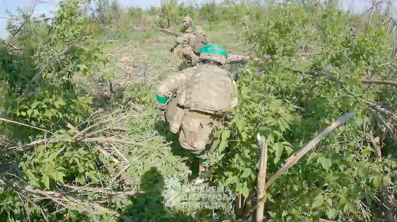 Ukrainian servicemen of the 3rd Assault Brigade move at their position on the front line in Donetsk region