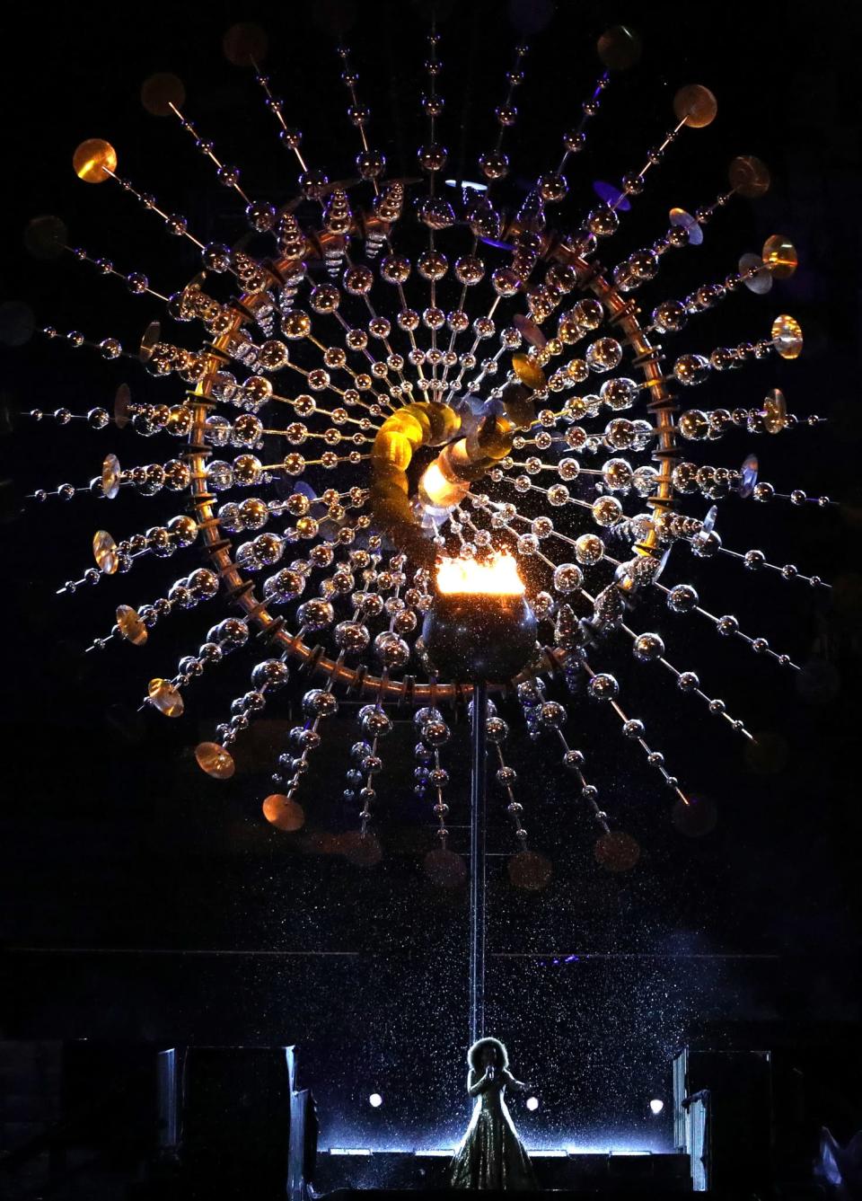 <p>Singer Mariene de Castro performs in front of the Olympic Cauldron while the Olympic flame is being extinguished during the Closing Ceremony on Day 16 of the Rio 2016 Olympic Games at Maracana Stadium on August 21, 2016 in Rio de Janeiro, Brazil. (Photo by Patrick Smith/Getty Images) </p>