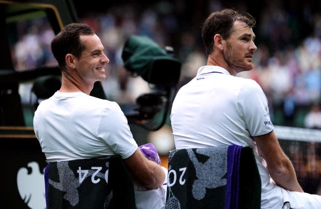 Andy and Jamie Murray sit on Centre Court