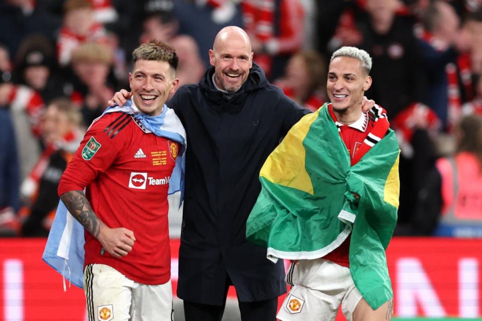 Ten Hag celebrates winning the Caraboa Cup with Martinez and Antony (Getty Images)