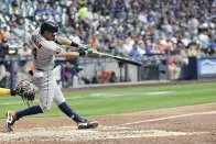 Houston Astros' Mauricio Dubon hits a home run during the fifth inning of a baseball game against the Milwaukee Brewers Monday, May 22, 2023, in Milwaukee. (AP Photo/Morry Gash)