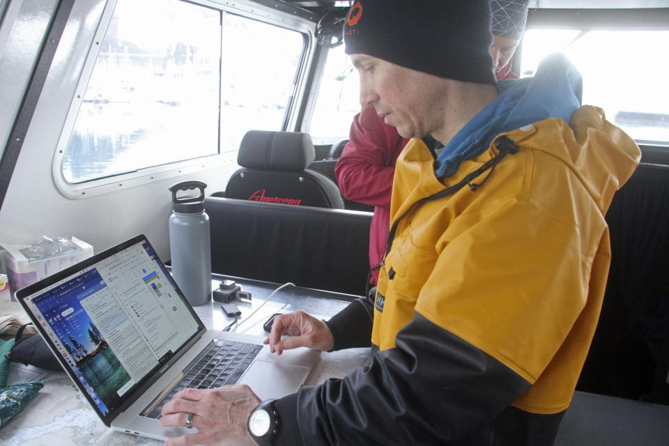 This May 4, 2022, photo shows University of Alaska Fairbanks oceanographer Andrew McDonnell checking data on his computer aboard the University of Alaska Fairbanks research vessel Nanuq in the Gulf of Alaska. The data was from a special sensor which was fitted to an underwater glider to study ocean acidification. (AP Photo/Mark Thiessen)