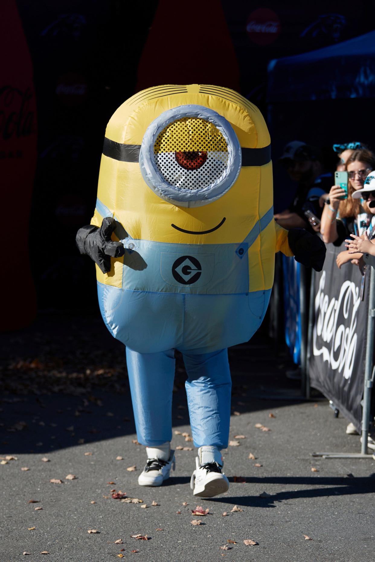 Carolina Panthers wide receiver Laviska Shenault Jr. (5) is dressed in a minion costume as he arrives at Bank of America Stadium prior to the team's game against the Houston Texans, Sunday, Oct. 29, 2023, in Charlotte, N.C.