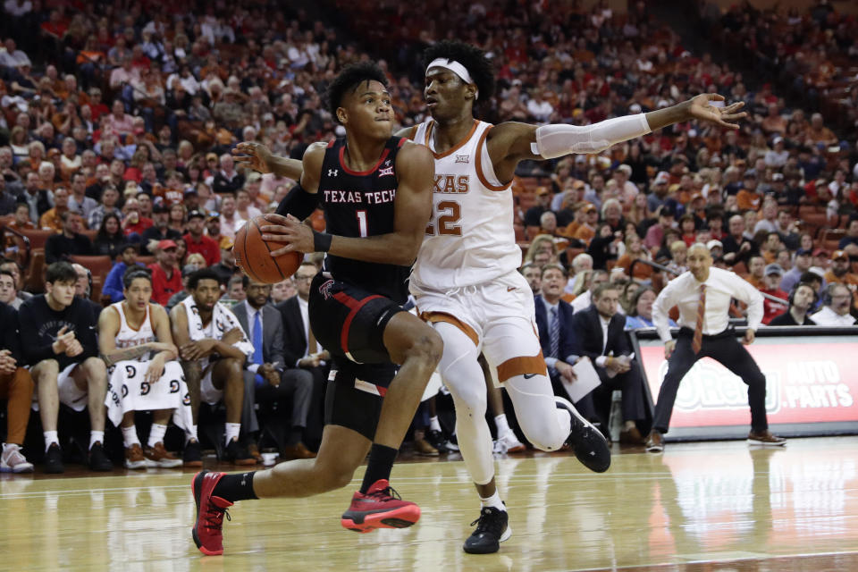 Texas Tech guard Terrence Shannon Jr. (1) drives to the basket past Texas forward Kai Jones (22) during the first half of an NCAA college basketball game, Saturday, Feb. 8, 2020, in Austin, Texas. (AP Photo/Eric Gay)