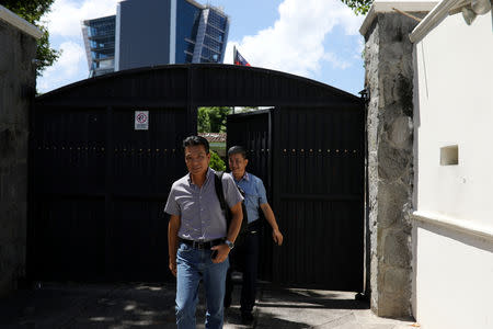 Taiwan nationals leave the Taiwan embassy a day after the Salvadoran government announced that it has broken off diplomatic relations with Taiwan, in San Salvador, El Salvador August 21, 2018. REUTERS/Jose Cabezas