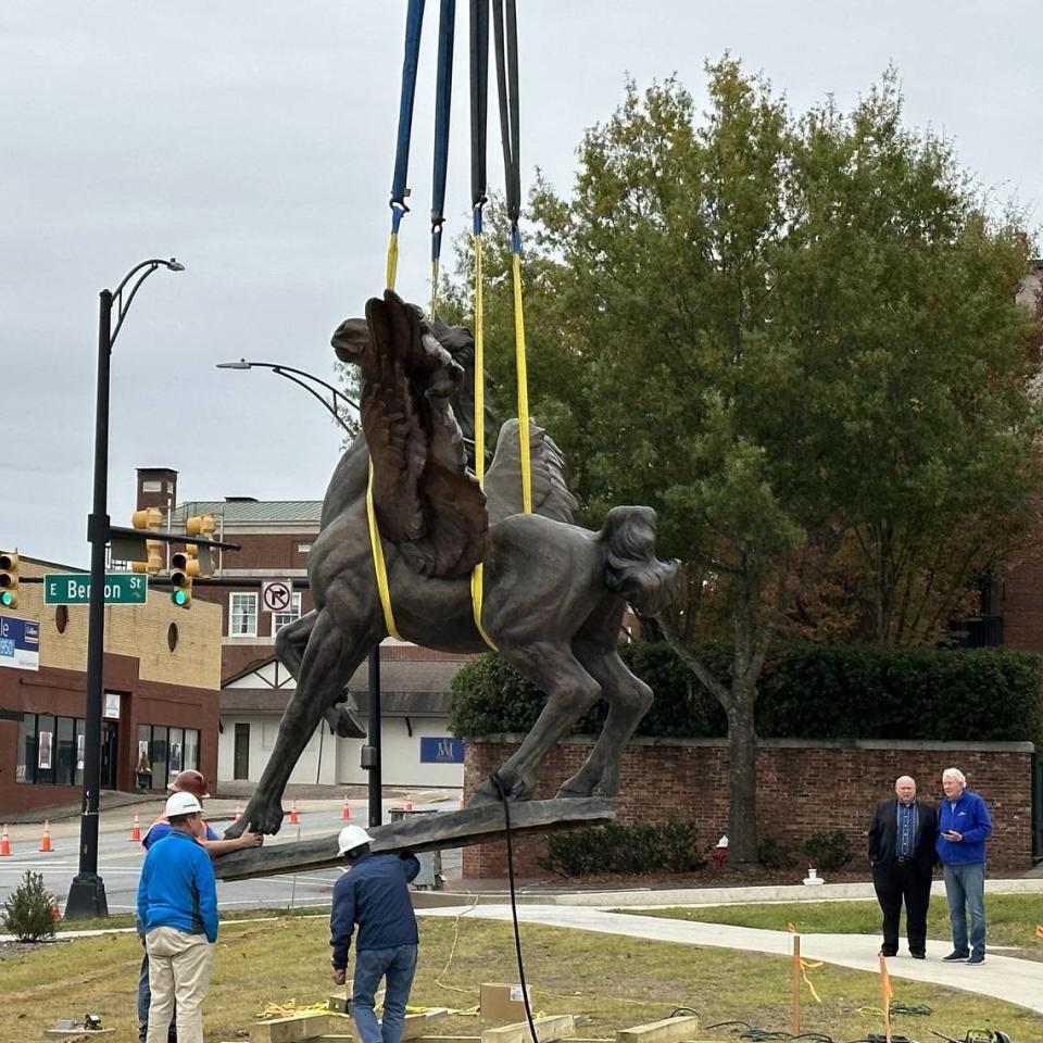 The installation of a winged Pegasus sculpture.