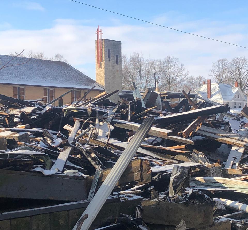 The morning after a deadly fire in the 1300 block of South Arch Avenue in Alliance sits the charred debris from a two-story house. Behind it is Alliance Church of the Nazarene. Firefighters said one person died in Thursday's blaze.