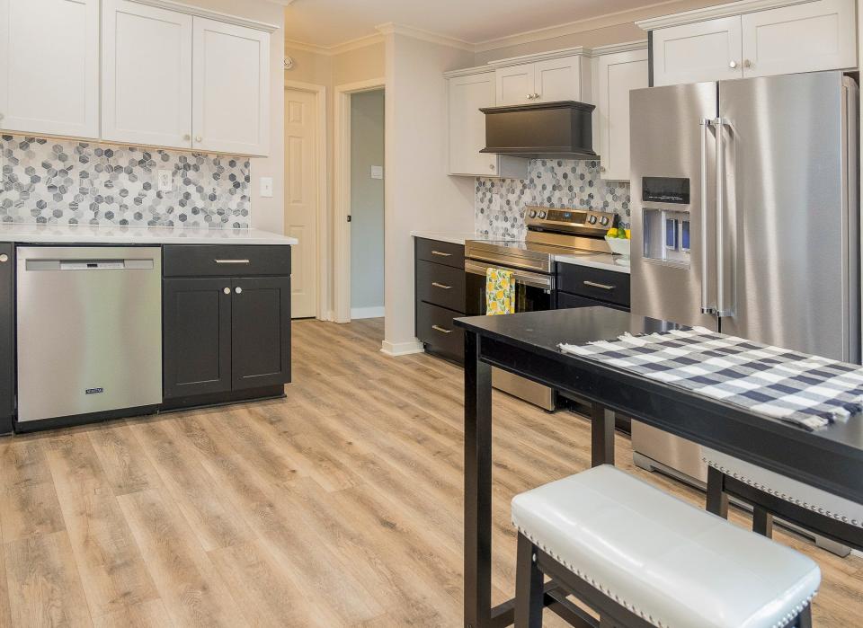 The recently renovated kitchen features all new appliances, countertops, cabinetry and back-splash.