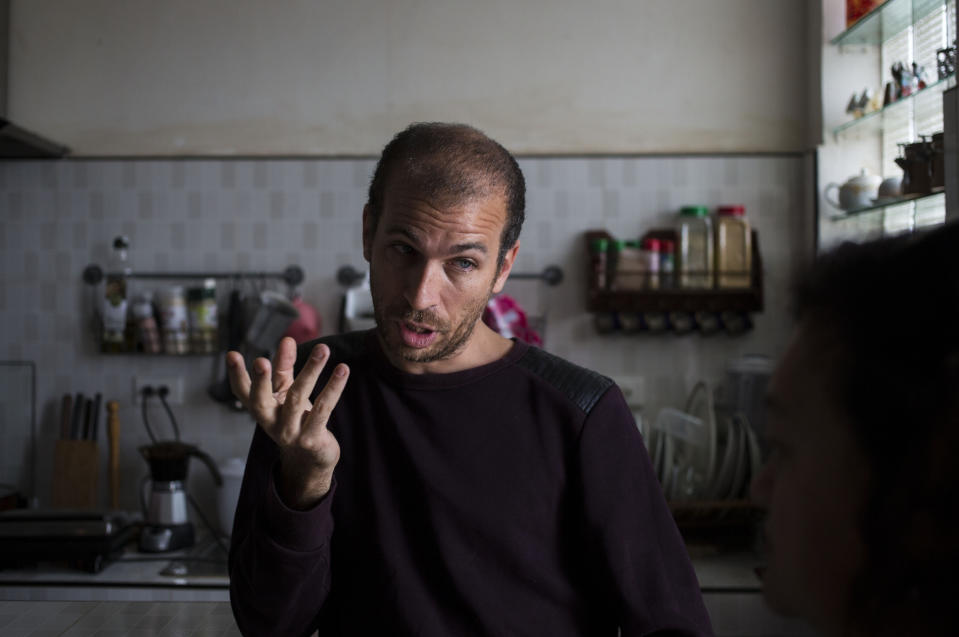 In this Nov. 30, 2018 photo, musician Michel Matos, 38, gives an interview in Havana, Cuba. Cuba is softening the impact of a heavily criticized new law that would have given government inspectors power to shut down any exhibition or performance deemed to violate the country's socialist revolutionary values. Matos, who was among those protesting in the streets against the law, called the decree "fascistic," adding that "it has a ton of subterfuges designed for cultural and ideological control and that's unacceptable for us." (AP Photo/Desmond Boylan)