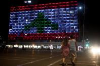 The municipality building is lit in the colours of the Lebanese flag in Tel Aviv