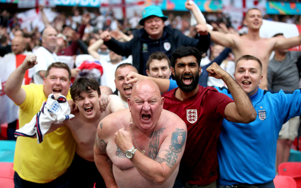 <p>England fans celebrate after the UEFA Euro 2020 round of 16 match at Wembley Stadium, London. Picture date: Tuesday June 29, 2021.</p>
