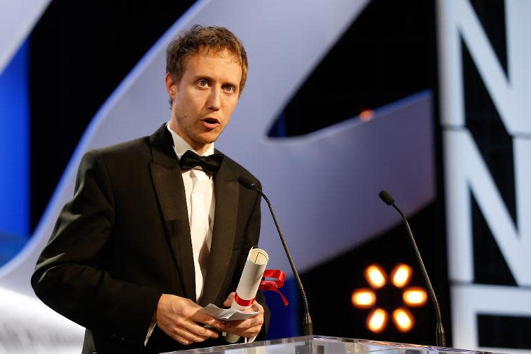 Hungarian director Laszlo Nemes accepts the Grand Jury prize at Cannes