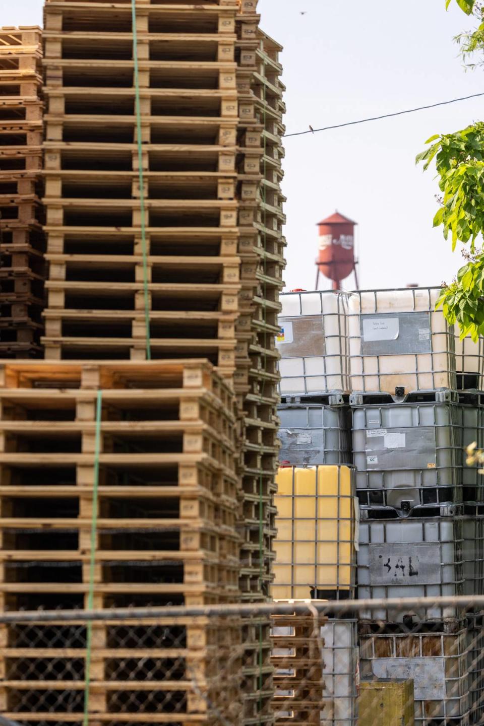 Pallets and liquid containers are piled high at Innospec, a chemical specialty company factory, adjacent to in High Point’s Southside neighborhood.