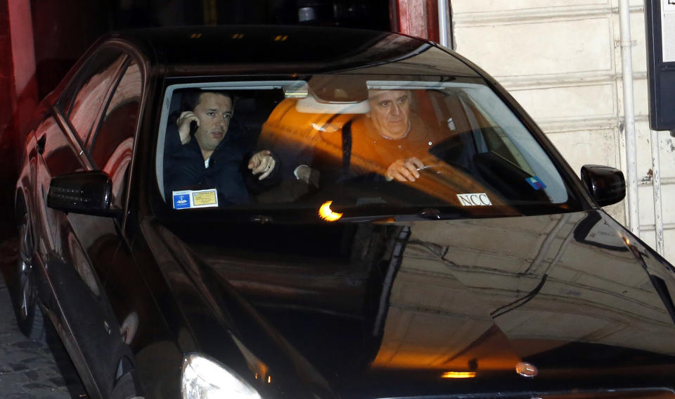 Democratic Party secretary Matteo Renzi leaves after speaking at a party leadership meeting to decide whether to yank support from Letta's fragile coalition government, accusing the premier of failing to make progress on key financial reforms, in Rome Thursday, Feb. 13, 2014. Italian Premier Enrico Letta announced that he is resigning after his party rival Renzi withdrew essential support for his tattered, 10-month-old coalition government. Letta said he will hand in his resignation to Italy's president on Friday, Feb. 14. (AP Photo/Riccardo De Luca)