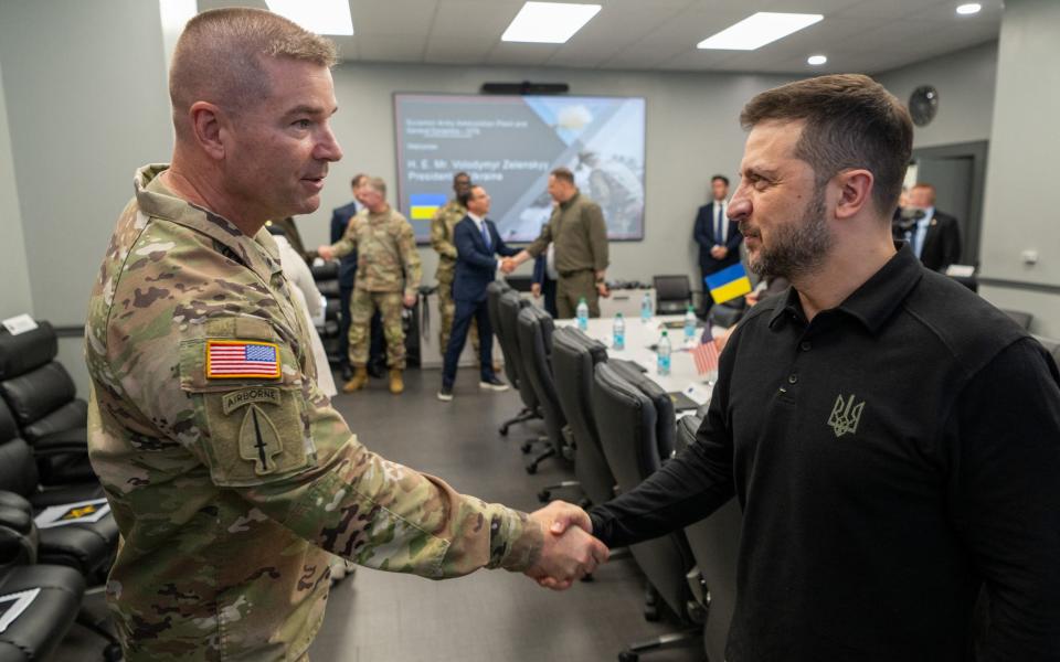 US Major General John T. Reim Jr, joint program executive officer armaments and ammunition, greets President Zelensky at the Scranton Army Ammunition Plant on Sunday