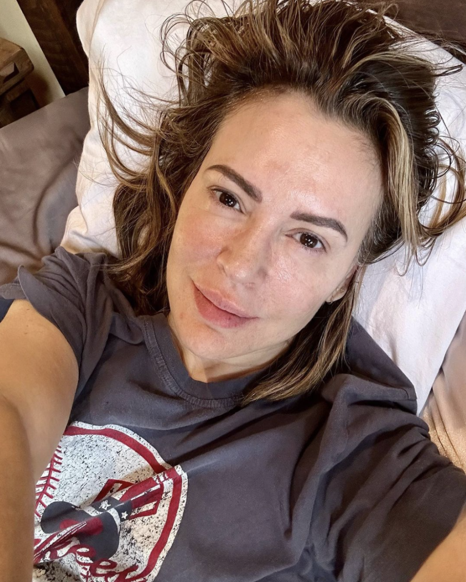 Alyssa Milano lays down and takes a selfie without any makeup on. 