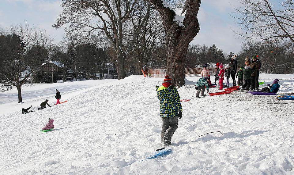 The hill at the Ashland Golf Club was a popular sledding site on Monday, Jan. 17, 2022. TOM E. PUSKAR/TIMES-GAZETTE.COM