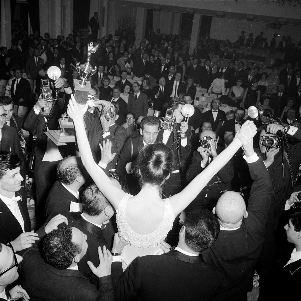 Gigliola Cinquetti poses for photographers after winning the 16th Sanremo Festival paired with Domenico Modugno with the song 'Dio, come ti amo', 1966.