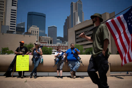 Gun advocates carry assault rifles during an open carry firearm rally on the sidelines of the annual National Rifle Association (NRA) meeting in Dallas, Texas, U.S., May 5, 2018. REUTERS/Adrees Latif