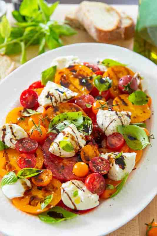 <p>fifteenspatulas</p><p>This burrata is amazing served with roasted balsamic tomatoes and makes the perfect appetizer!</p><p><strong>Get the recipe: <a href="https://www.fifteenspatulas.com/tomato-burrata-salad/" rel="nofollow noopener" target="_blank" data-ylk="slk:Tomato Burrata Salad;elm:context_link;itc:0;sec:content-canvas" class="link "><em>Tomato Burrata Salad</em></a></strong></p>