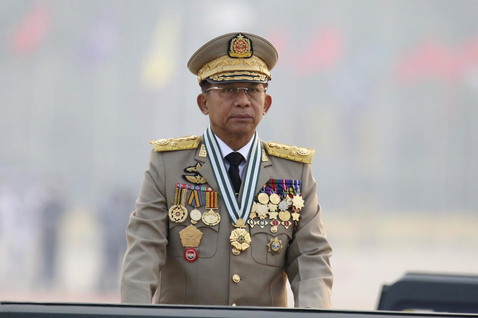 Myanmar's Commander-in-Chief Senior General Min Aung Hlaing presides an army parade on Armed Forces Day in Naypyitaw, Myanmar, Saturday, March 27, 2021. The head of Myanmar’s junta on Saturday used the occasion of the country’s Armed Forces Day to try to justify the overthrow of the elected government of Aung San Suu Kyi, as protesters marked the holiday by calling for even bigger demonstrations.(AP Photo)