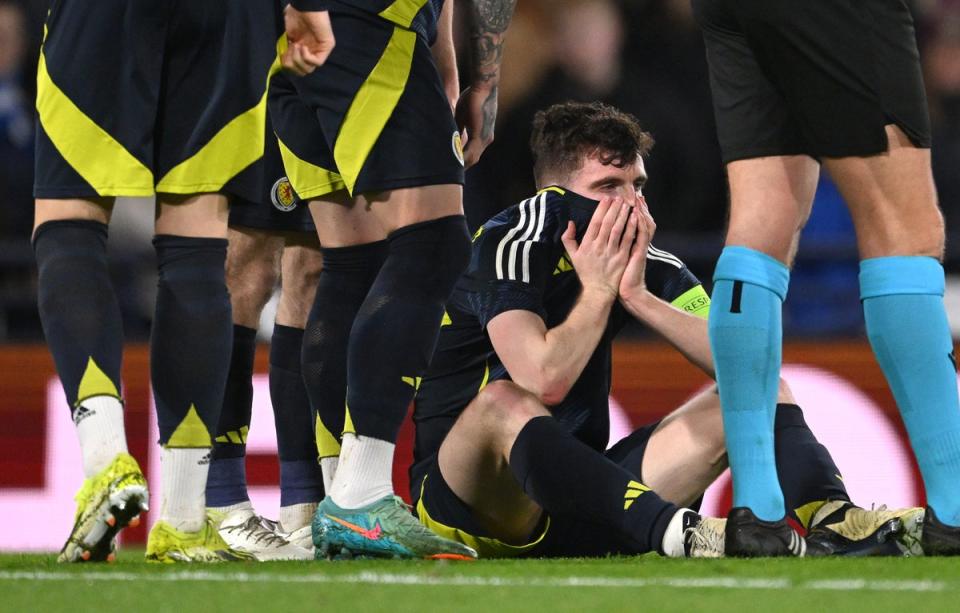 Scotland captain Andy Robertson reacts after picking up an ankle injury (Getty Images)