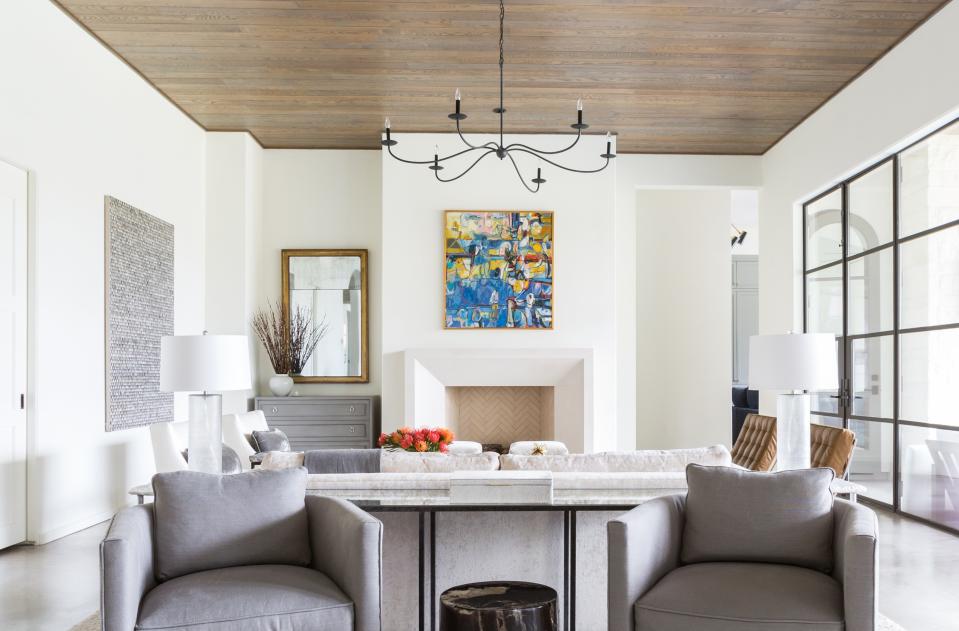 A bold painting in a neutral room by Marie Flanigan.