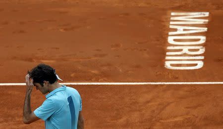 Roger Federer of Switzerland reacts during his match against Nick Kyrgios of Australia at the Madrid Open tennis tournament in Madrid, Spain, May 6, 2015. REUTERS/Susana Vera