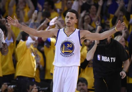 May 19, 2015; Oakland, CA, USA; Golden State Warriors guard Stephen Curry (30) gestures to the crowd in the second half in game one of the Western Conference Finals of the NBA Playoffs against the Houston Rockets at Oracle Arena. Mandatory Credit: Kyle Terada-USA TODAY Sports