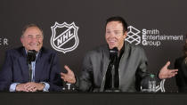 NHL Commissioner Gary Bettman, left, and Ryan Smith, co-founder and chairman of Smith Entertainment Group, speak during a news conference Friday, April 19, 2024, in Salt Lake City about the move of the Arizona Coyotes' franchise to Utah. (AP Photo/Rick Bowmer)