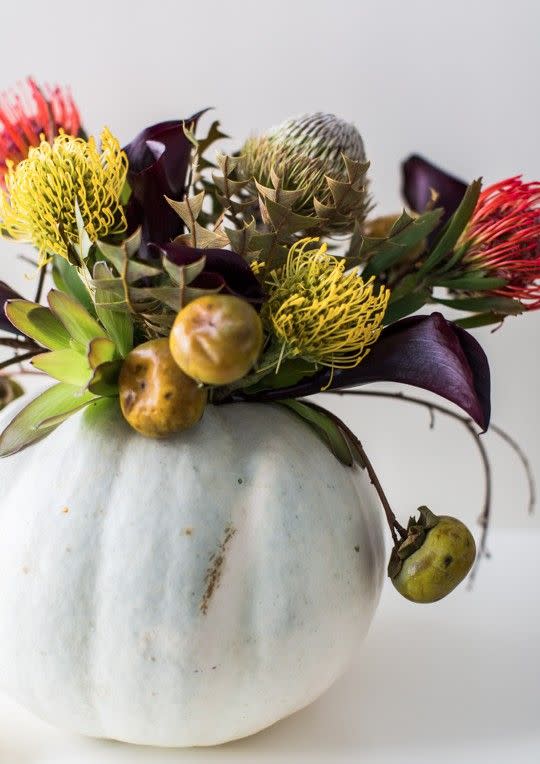 <p>Turn your pumpkin into a vase for a Halloween-chic centerpiece. Beyond the pumpkin, it's perfectly Halloweenie thanks to the flowers and persimmons used to fill the vase. Get the tutorial from <a href="https://sugarandcloth.com/diy-halloween-floral-centerpiece/" rel="nofollow noopener" target="_blank" data-ylk="slk:Sugar & Cloth;elm:context_link;itc:0;sec:content-canvas" class="link ">Sugar & Cloth</a>. </p><p><a class="link " href="https://www.amazon.com/Oasis-Floral-Design-Flower-Crafting/dp/B07WFHP5RW/?tag=syn-yahoo-20&ascsubtag=%5Bartid%7C10057.g.2554%5Bsrc%7Cyahoo-us" rel="nofollow noopener" target="_blank" data-ylk="slk:BUY NOW;elm:context_link;itc:0;sec:content-canvas">BUY NOW</a> <strong><em>Floral Tape, $7</em></strong></p>