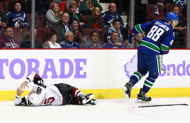 VANCOUVER, BC - NOVEMBER 17: Nikita Tryamkin #88 of the Vancouver Canucks skates away after colliding with Brad Richardson #15 of the Arizona Coyotes during their NHL game at Rogers Arena November 17, 2016 in Vancouver, British Columbia, Canada. (Photo by Jeff Vinnick/NHLI via Getty Images)