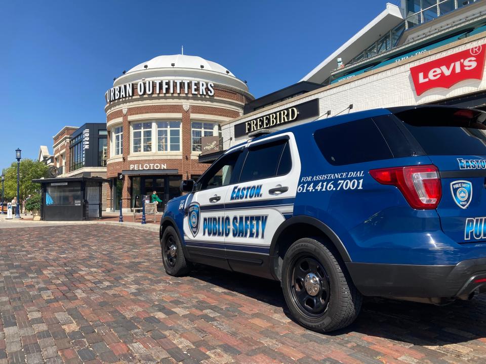An Easton security vehicle sites outside the Levi's store at Easton Town Center Monday morning after a victim who is believed to be a teenage boy was shot and killed at Easton Sunday night. Two 13-year-old have been arrested in connection with the shooting.