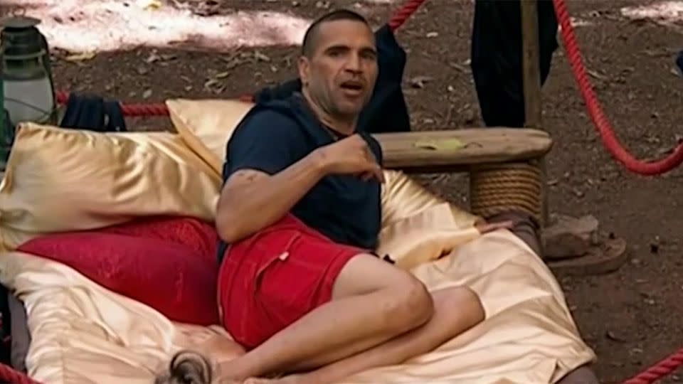 Mundine relaxed in his bed as he argued women should cook for him. Pic: Ten