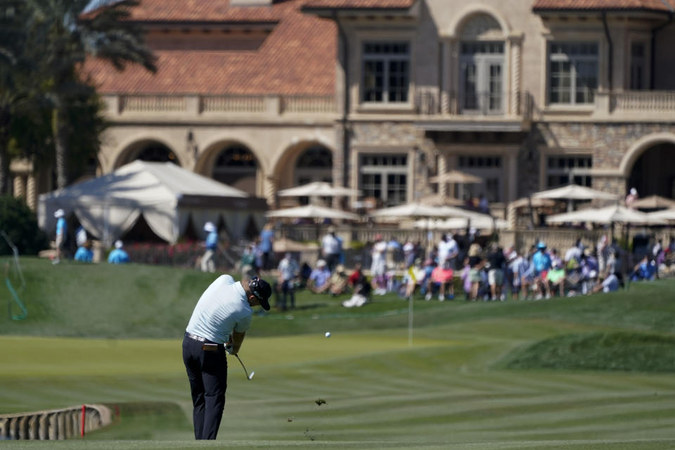 Talor Gooch hits from the fairway on the 18th hole during the second round of the The Players Championship golf tournament Friday, March 12, 2021, in Ponte Vedra Beach, Fla. (AP Photo/Gerald Herbert)