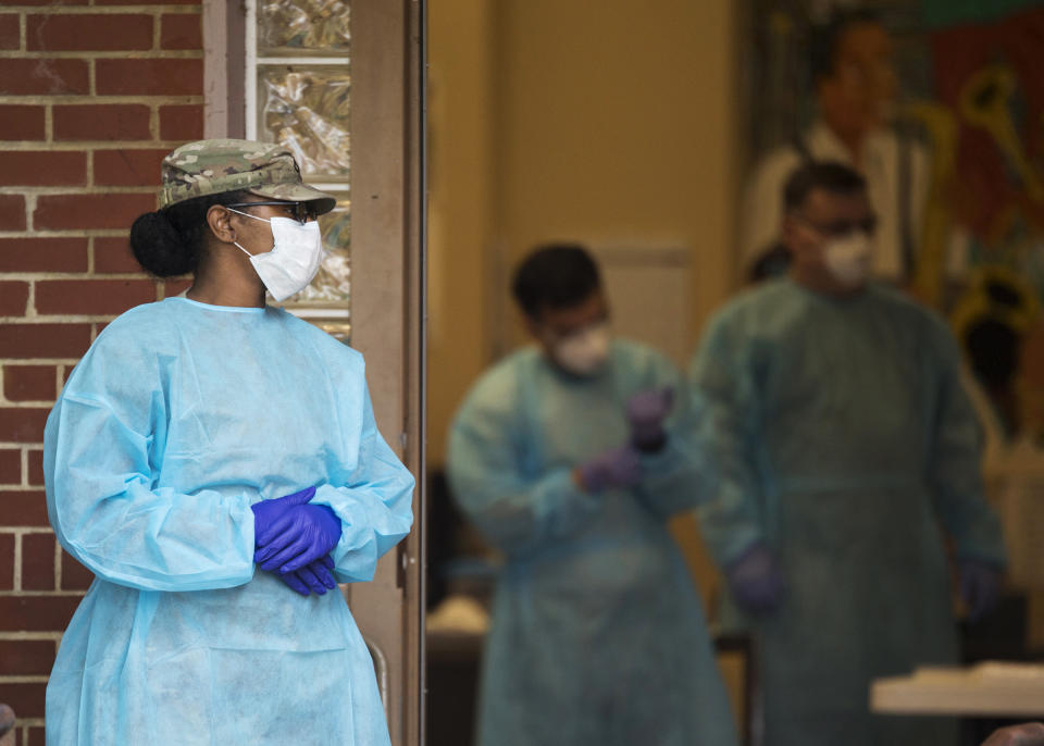 IMAGE: Tennessee National Guard medical staff members  (Troy Stolt / Chattanooga Times Free Press via AP)